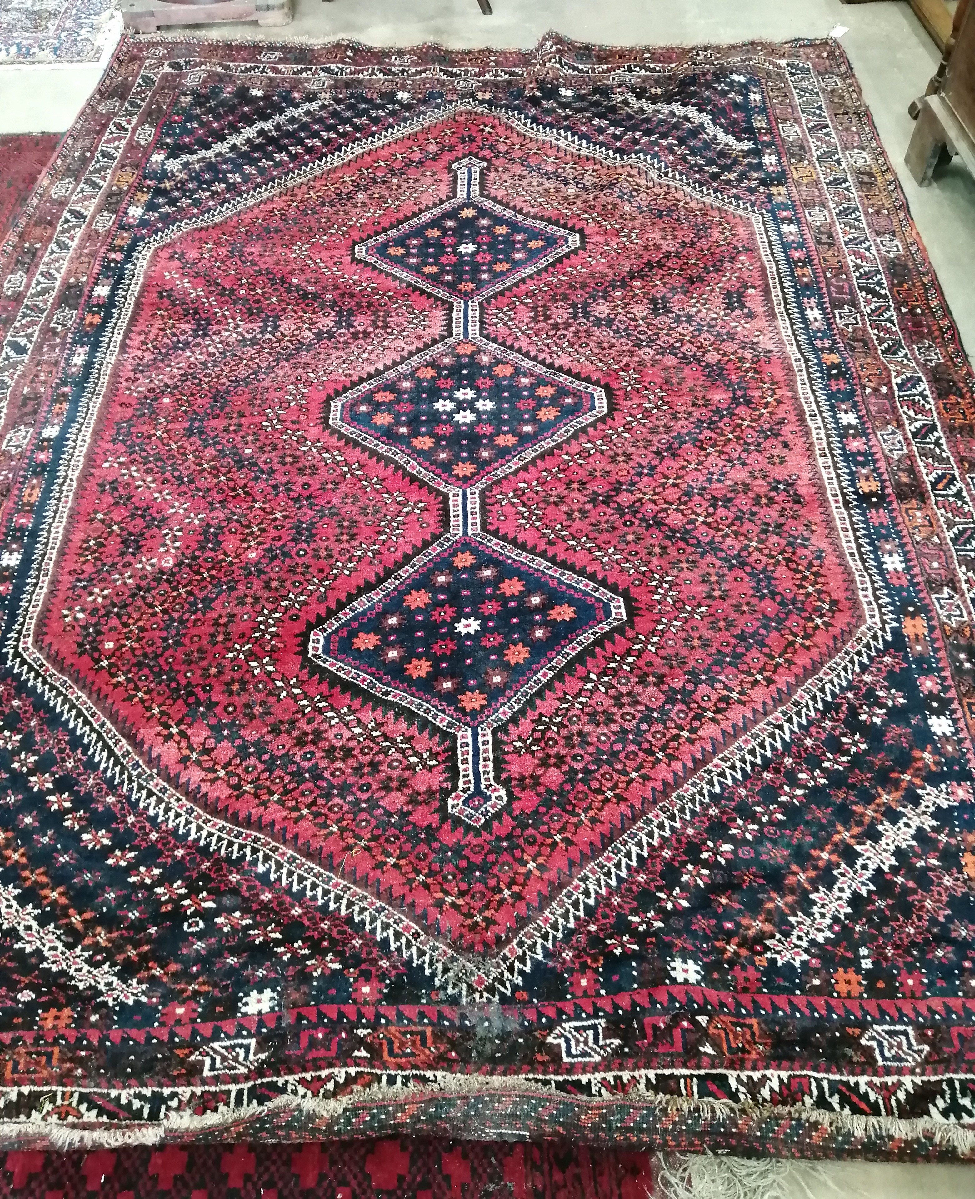 A North West Persian blue and red ground carpet, 290 x 210cm
